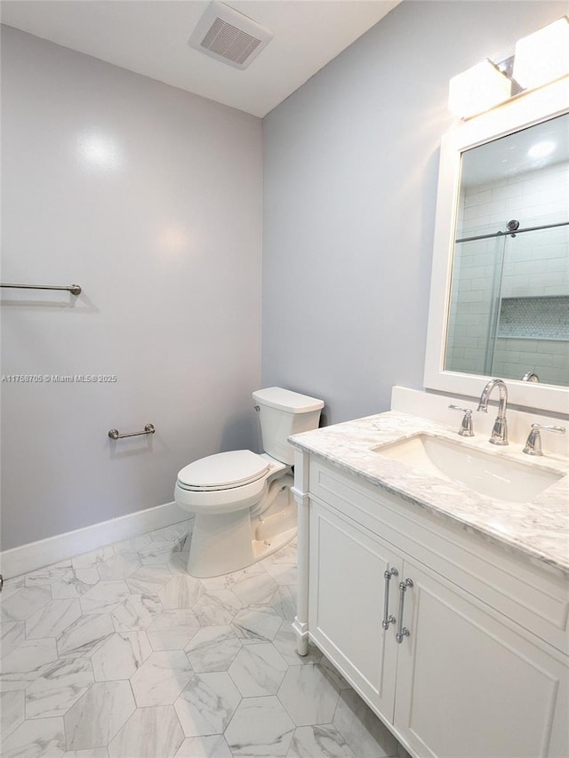 full bath with marble finish floor, visible vents, toilet, tiled shower, and baseboards