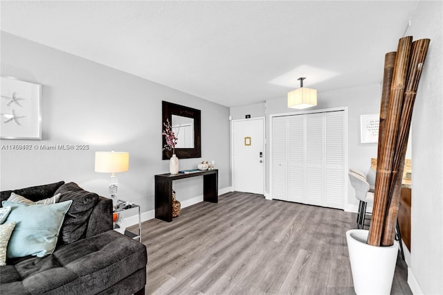 living room with wood finished floors and baseboards