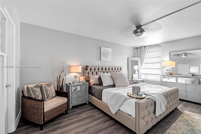 bedroom featuring a ceiling fan and wood finished floors