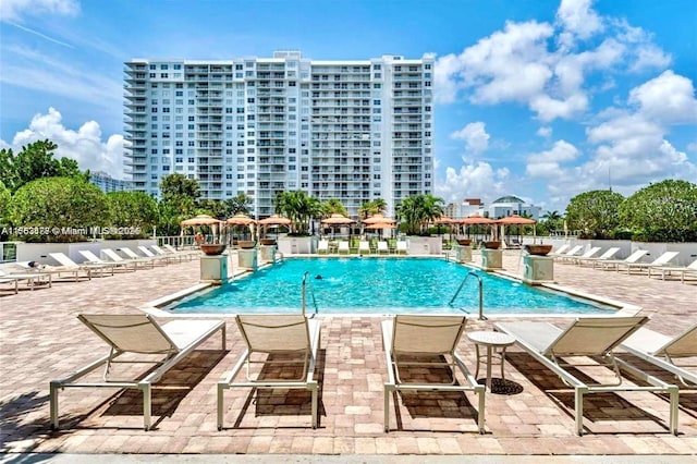 pool featuring a patio area and fence