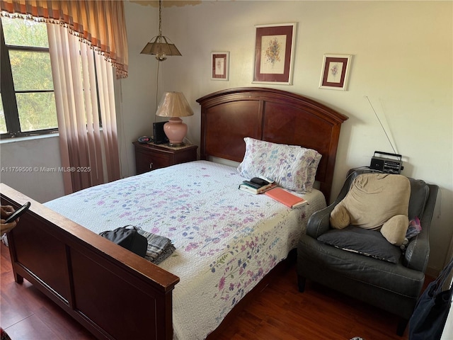 bedroom with wood finished floors