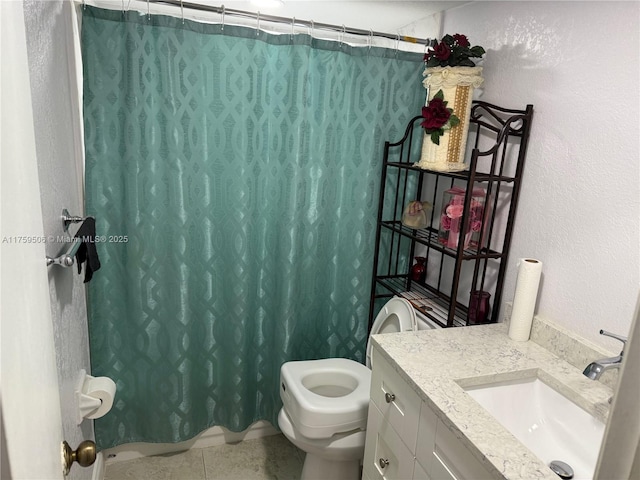 full bath with a textured wall, toilet, a shower with shower curtain, vanity, and tile patterned floors