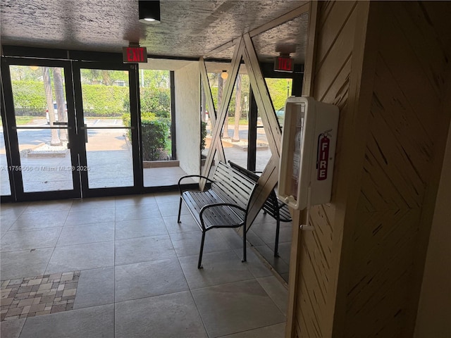 unfurnished sunroom with french doors