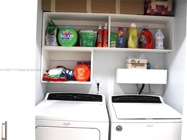 washroom with washing machine and clothes dryer and laundry area