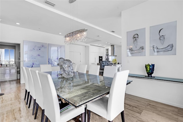 dining space with recessed lighting, visible vents, a notable chandelier, and baseboards