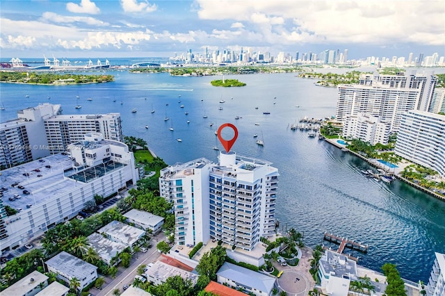 drone / aerial view with a view of city and a water view