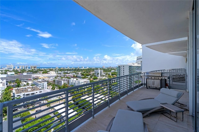 balcony with a grill and a view of city