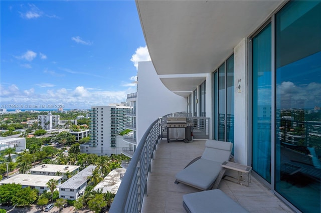 balcony featuring grilling area and a city view