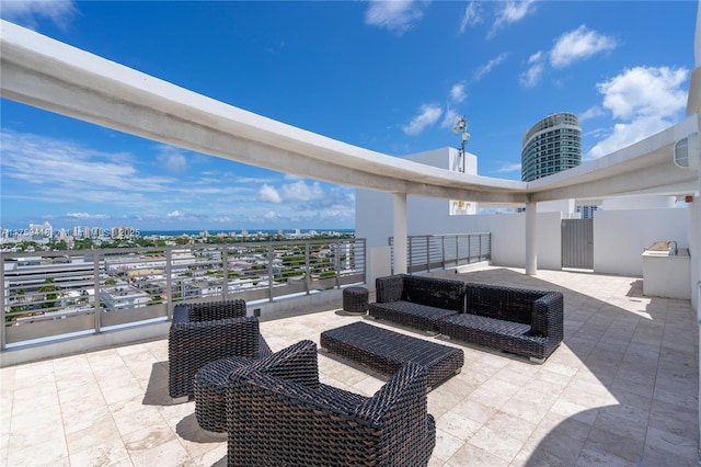 view of patio / terrace featuring a view of city and an outdoor living space