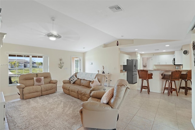 living room with ceiling fan, light tile patterned flooring, recessed lighting, visible vents, and vaulted ceiling