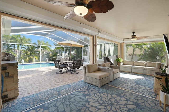 sunroom featuring plenty of natural light, visible vents, and ceiling fan