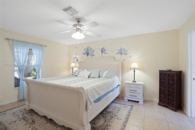 bedroom featuring visible vents, ceiling fan, baseboards, and light tile patterned flooring