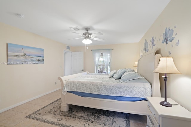 bedroom featuring light tile patterned floors, a ceiling fan, visible vents, and baseboards