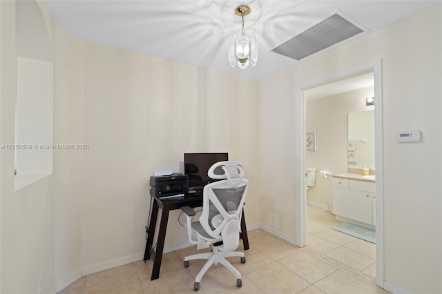 office space featuring light tile patterned floors, baseboards, and visible vents