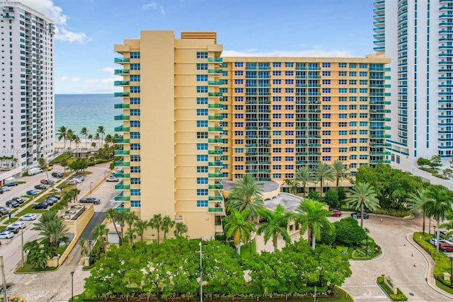 view of property featuring a water view and a city view