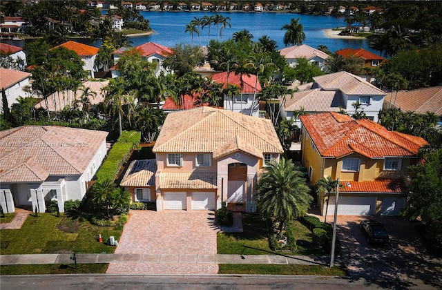 bird's eye view featuring a water view and a residential view