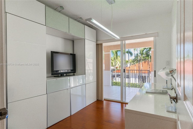 kitchen with light countertops and wood finished floors