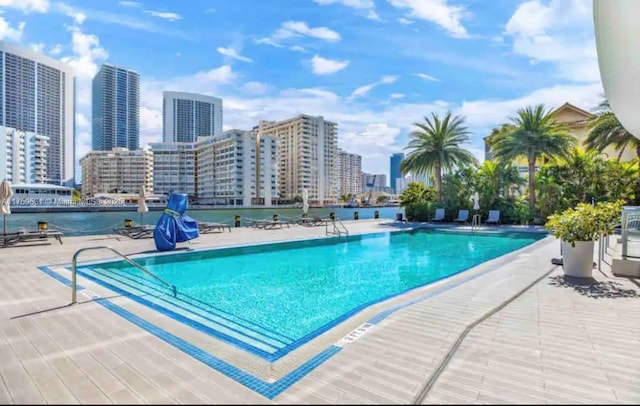 community pool featuring a city view and a patio