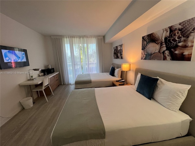 bedroom featuring wood finished floors