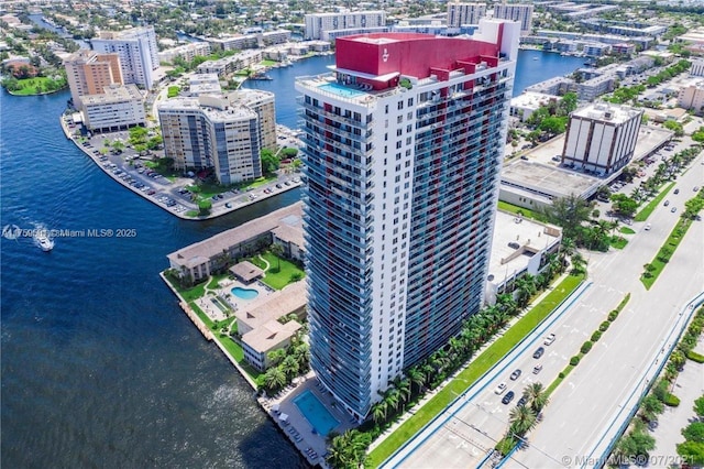 birds eye view of property featuring a view of city and a water view