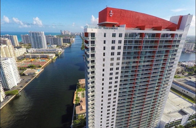 exterior space with a water view and a city view