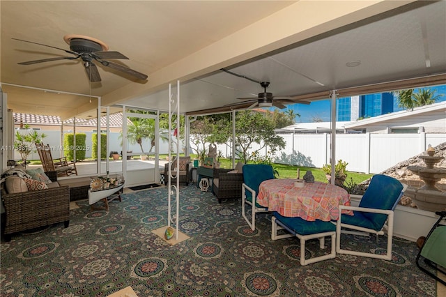 view of patio featuring ceiling fan, outdoor lounge area, and fence