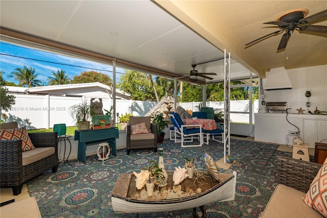 sunroom featuring ceiling fan