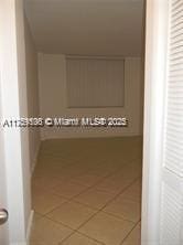 hall featuring tile patterned flooring