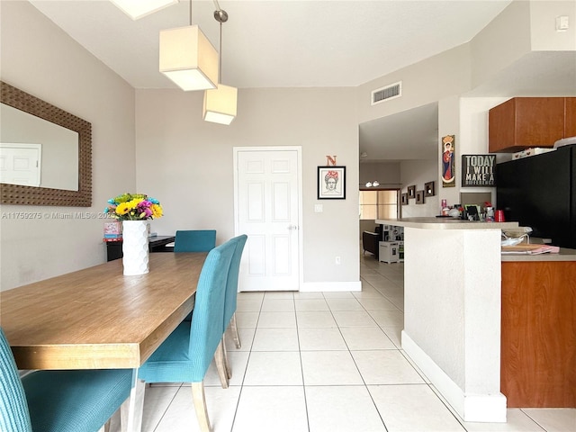 interior space with light tile patterned floors, baseboards, and visible vents