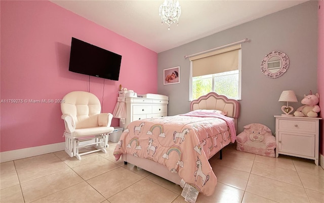 bedroom featuring baseboards and light tile patterned flooring