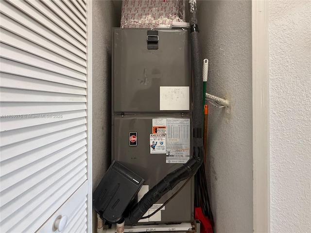 utility room featuring heating unit