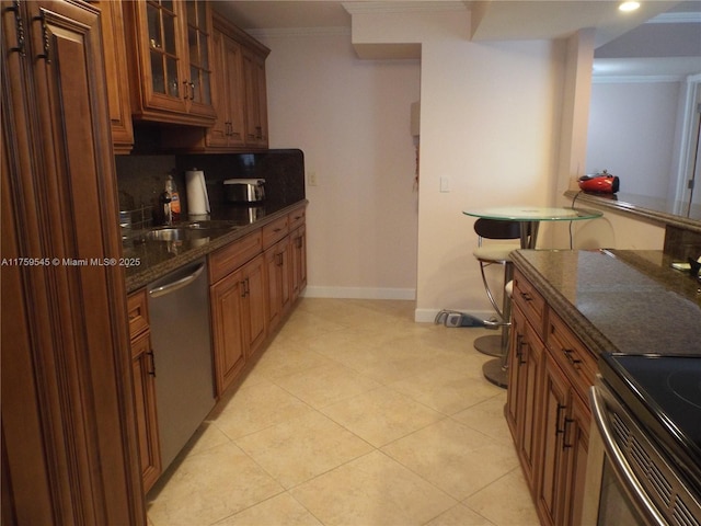 kitchen with crown molding, a sink, brown cabinetry, glass insert cabinets, and dishwasher