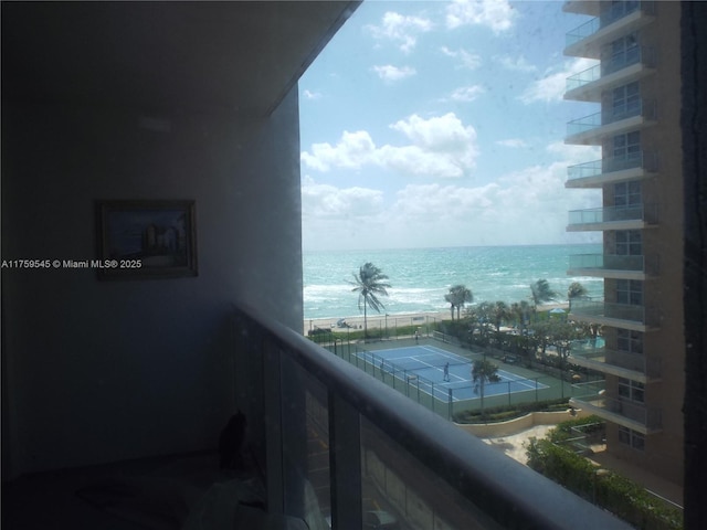 balcony featuring a water view