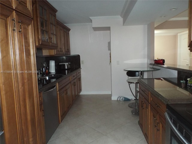 kitchen featuring dishwasher, a sink, glass insert cabinets, crown molding, and brown cabinetry