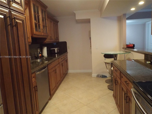 kitchen featuring stainless steel dishwasher, brown cabinetry, ornamental molding, a sink, and glass insert cabinets