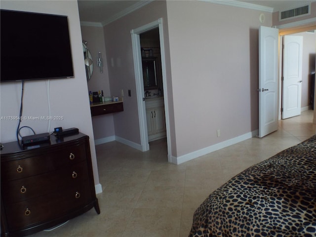 bedroom featuring baseboards, visible vents, crown molding, ensuite bath, and light tile patterned floors