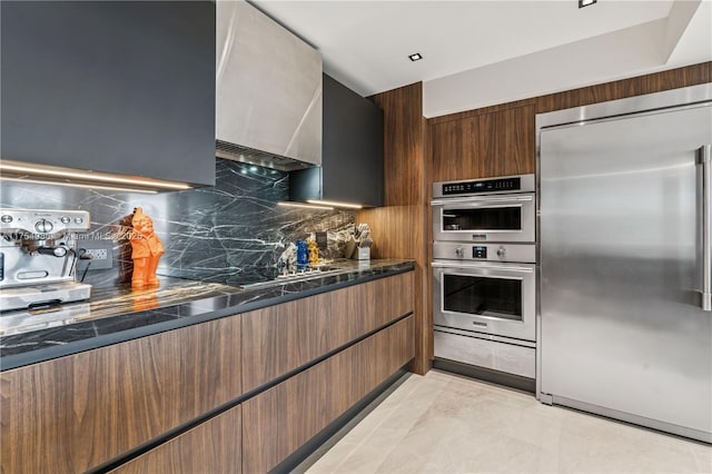 19667 Turnberry Way Unit 8K, Aventura, FL 33180 - kitchen featuring decorative backsplash, wall chimney exhaust hood, modern cabinets, and stainless steel appliances