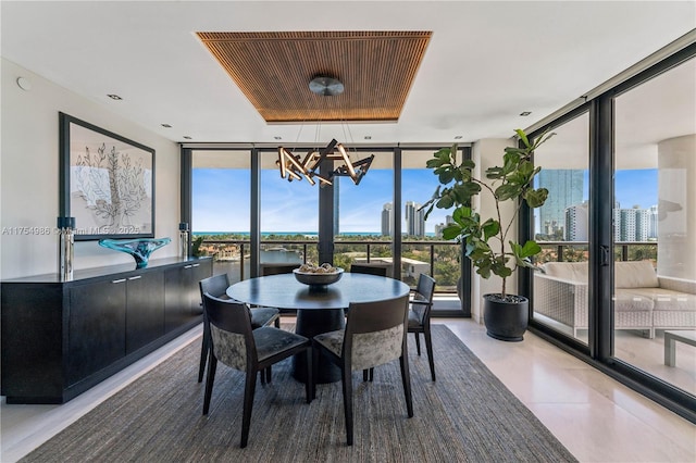 19667 Turnberry Way Unit 8K, Aventura, FL 33180 - dining space with expansive windows, an inviting chandelier, and a healthy amount of sunlight