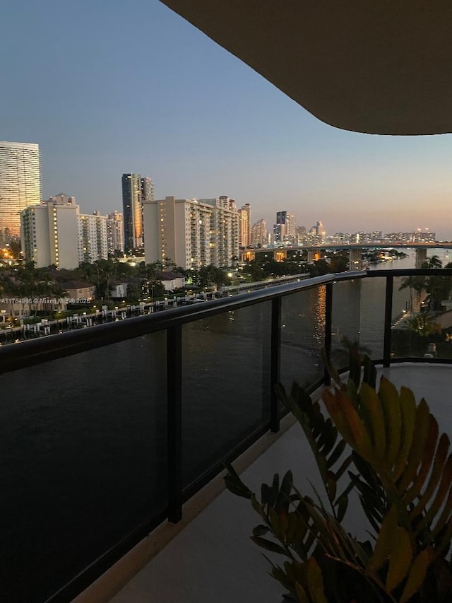 19667 Turnberry Way Unit 8K, Aventura, FL 33180 - balcony at dusk featuring a water view and a view of city