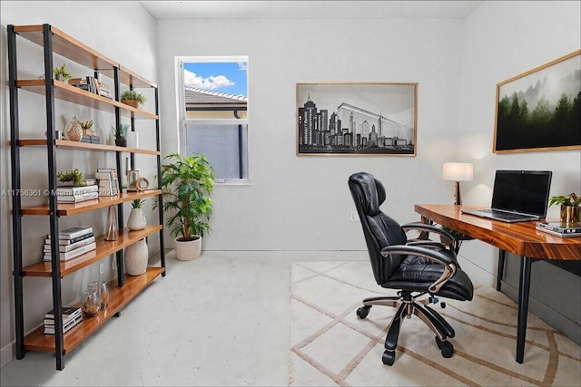 home office featuring concrete floors