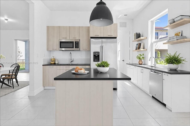 kitchen with open shelves, dark countertops, appliances with stainless steel finishes, and light tile patterned floors