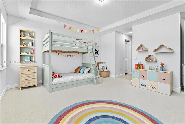 bedroom with carpet and baseboards