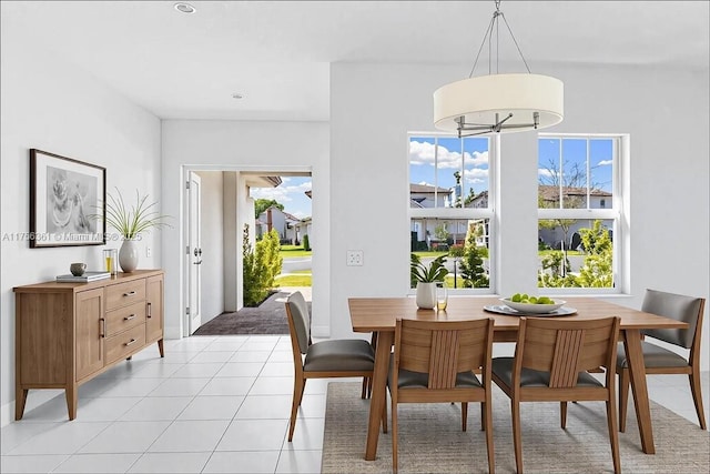 dining room with light tile patterned floors and plenty of natural light