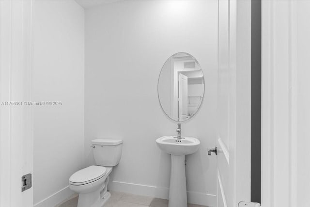 bathroom with visible vents, baseboards, toilet, and tile patterned flooring