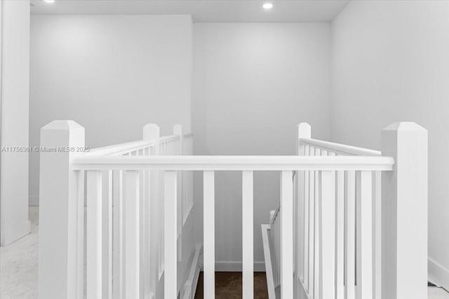 stairway featuring recessed lighting