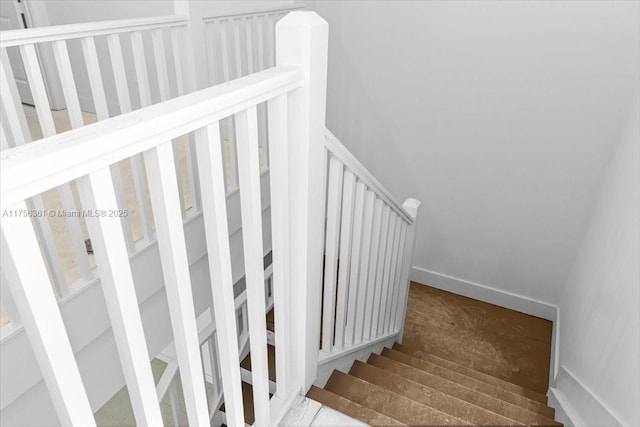 stairway with baseboards