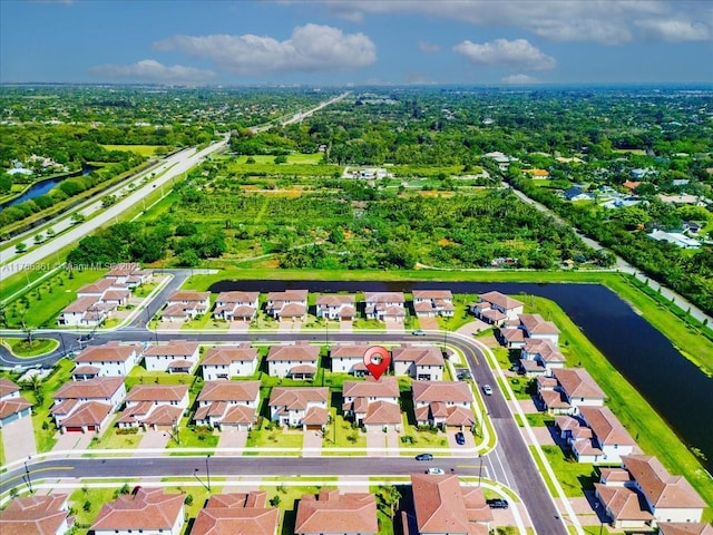 aerial view featuring a residential view and a water view