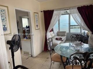 2156 NW 32nd St, Miami, FL 33142 - dining space with light tile patterned floors