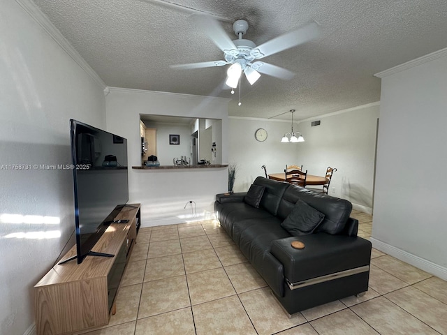 living area featuring light tile patterned floors, visible vents, ornamental molding, ceiling fan, and a textured ceiling