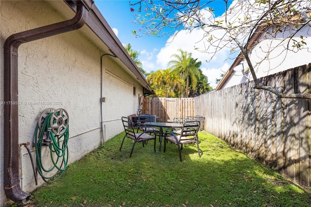 view of yard with a fenced backyard